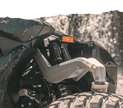 Close-up of a vehicle suspension system with Can-Am Maverick R X RS 2ST Stage 1 Spring Kit.